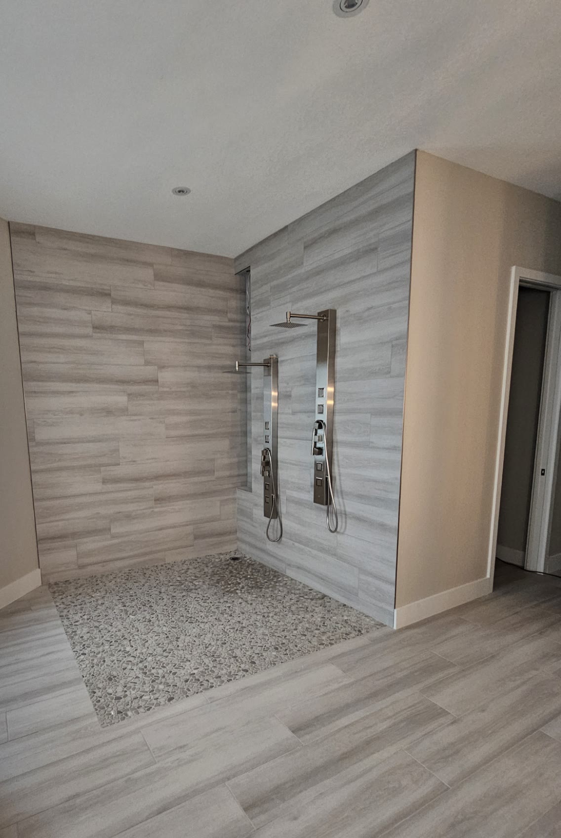 Wet-room bathroom remodel with double shower in Naples, FL by GC Pro West